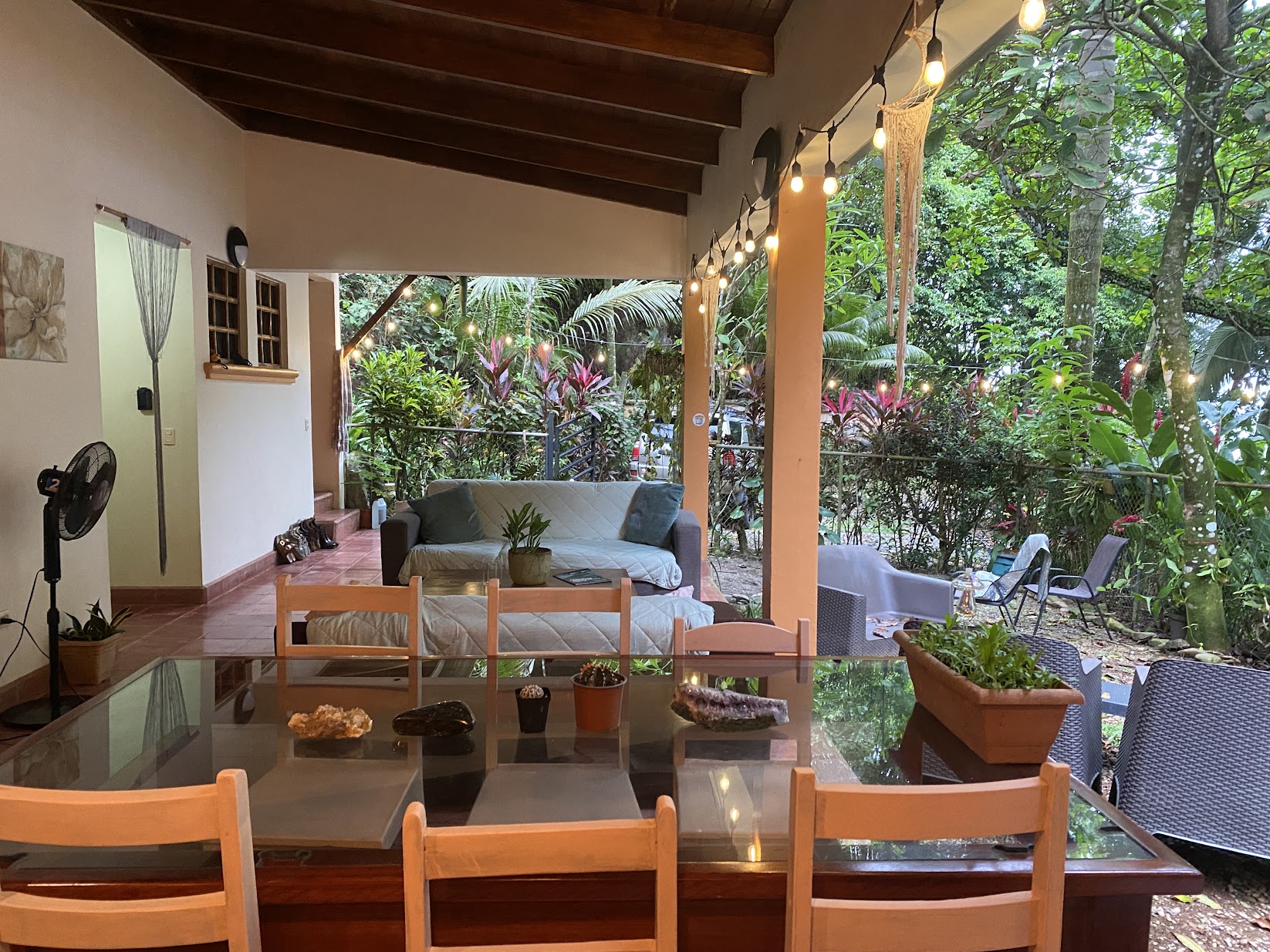 Our open living and dining patio with warm string lights